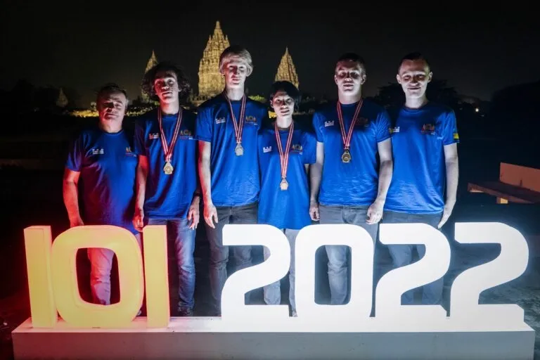 Ukraine’s team behind large illuminated letters reading “IOI 2022”